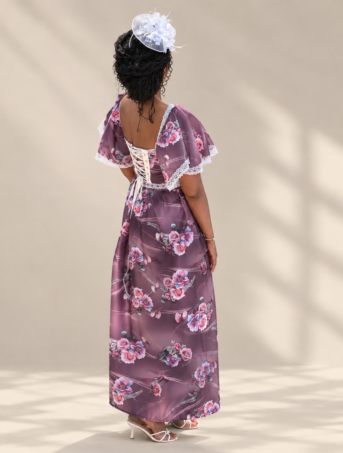Plum floral maxi dress with flutter sleeves and corset lace-up back